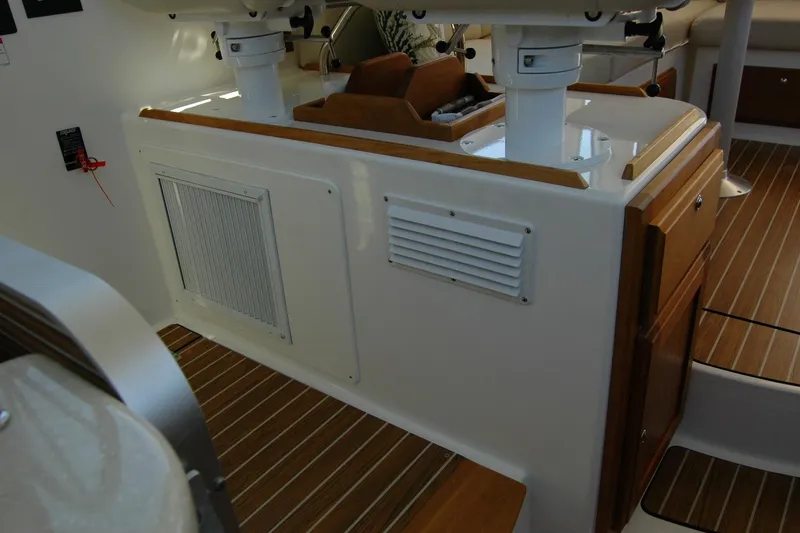 Slide: The Image of 2014 Back Cove 37 interior with wood accents and ventilation panels. - 86