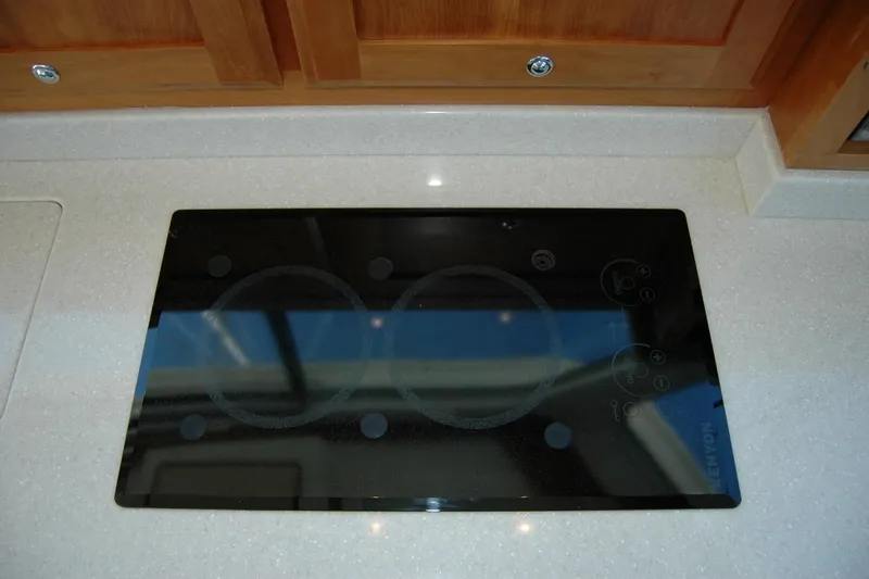 Slide: The Image of Stovetop on 2014 Back Cove 37 yacht with sleek black glass surface. - 91
