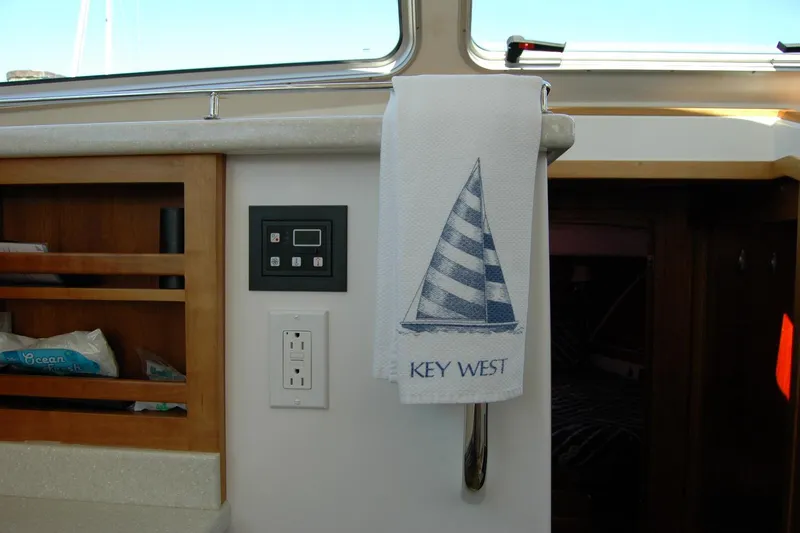 Slide: The Image of Interior of 2014 Back Cove 37 boat with Key West towel and control panel. - 92