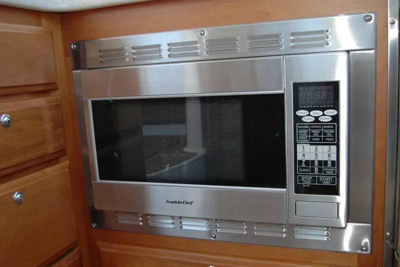 Slide: The Image of Built-in Franklin Chef microwave in 2014 Back Cove 37 yacht kitchen. - 93