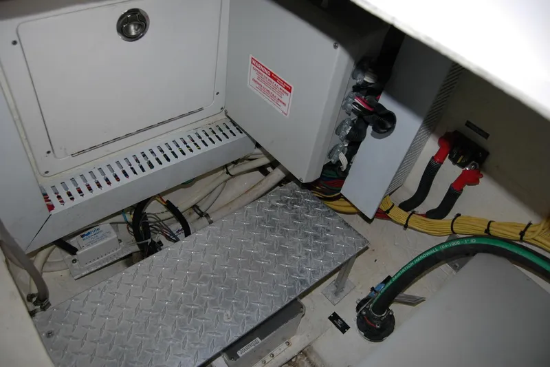 Slide: The Image of Engine room of 2014 Back Cove 37 boat with electrical components and wiring. - 98