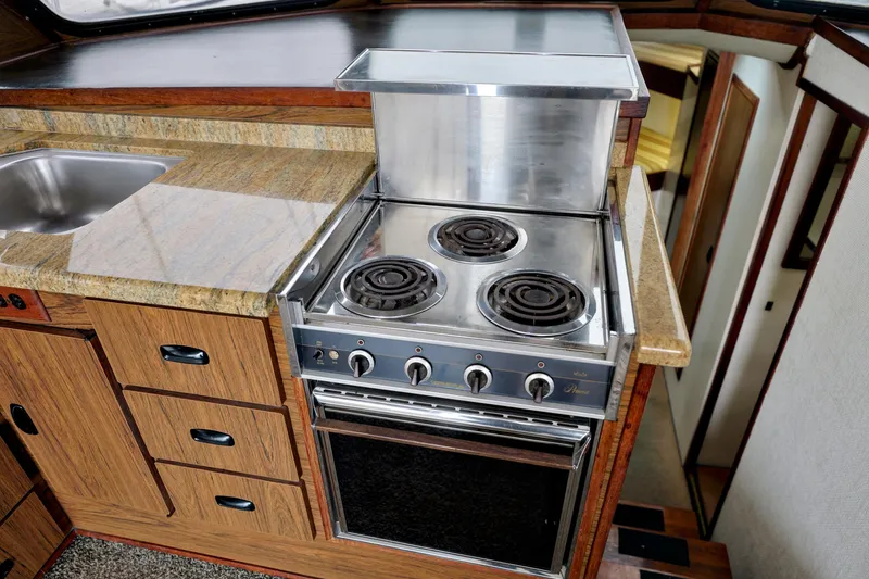 Slide: The Image of Kitchen area of 1980 Pacifica 41 Sportfisher with stove and sink. - 10