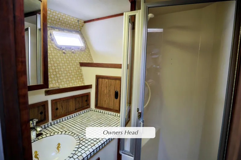 Slide: The Image of 1980 Pacifica 41 Sportfisher owner's head with tiled countertop and shower. - 14