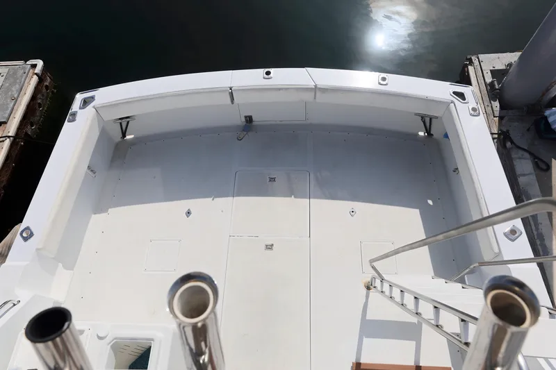 Slide: The Image of 1980 Pacifica 41 Sportfisher boat deck, spacious and clean, docked at marina. - 6