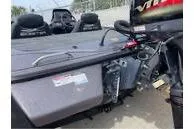 Slide: The Image of 2024 Skeeter ZX150 boat rear view with motor and seating. - 4