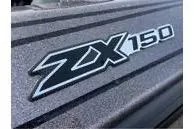 Slide: The Image of 2024 Skeeter ZX150 logo on textured surface, showcasing sleek design. - 7