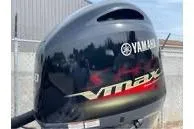 Slide: The Image of 2024 Skeeter ZX150 with Yamaha VMAX outboard motor, sleek design, outdoor setting. - 8