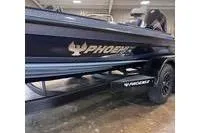 Slide: The Image of 2026 Phoenix ZXL Series 721 boat, sleek design, displayed indoors on a trailer. - 4