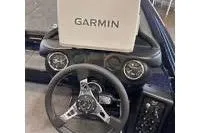 Slide: The Image of 2026 Phoenix ZXL Series 721 dashboard with Garmin navigation system and sleek steering wheel design. - 7