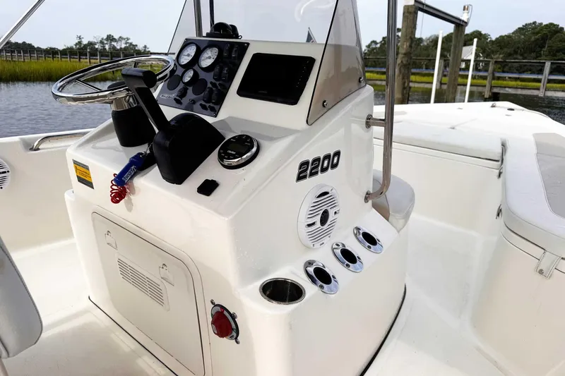 Slide: The Image of 2021 Bulls Bay 2200 boat console with steering wheel and control panel. - 17
