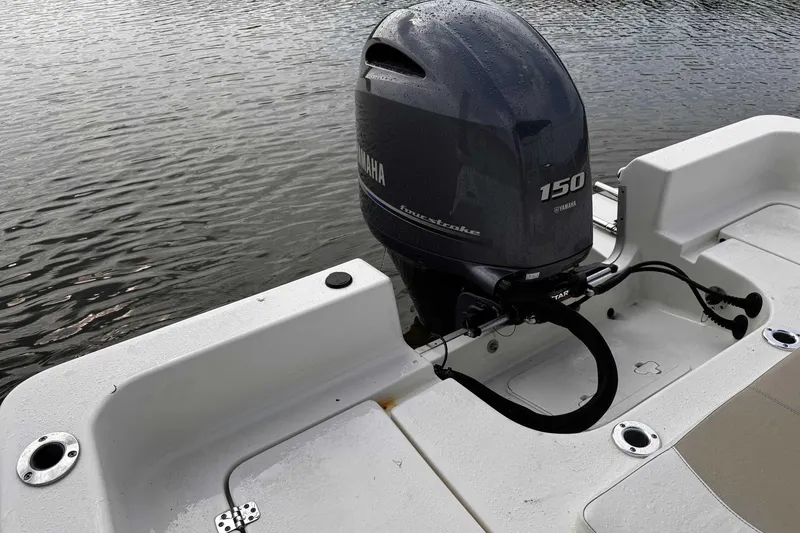 Slide: The Image of 2021 Bulls Bay 2200 boat with Yamaha 150 outboard motor on water. - 22