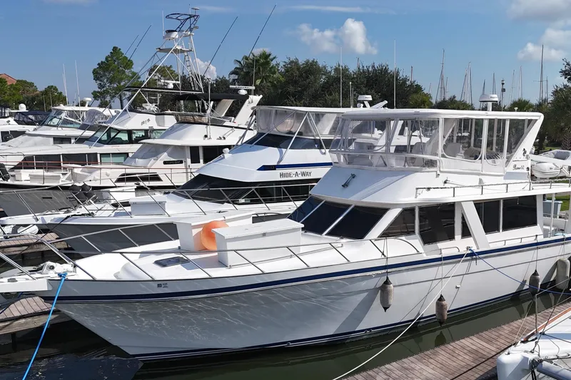 Slide: The Image of Docked Prima 52 Seahorse yacht, 2001 model, in a marina with other boats. - 1