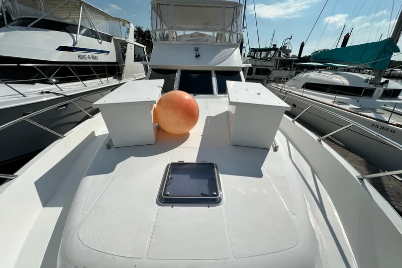 Slide: The Image of Deck of 2001 Prima 52 Seahorse yacht with orange buoy, docked at marina. - 10