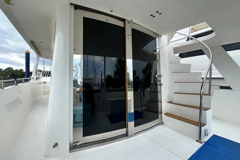 Slide: The Image of Staircase and glass doors on 2001 Prima 52 Seahorse yacht deck. - 21