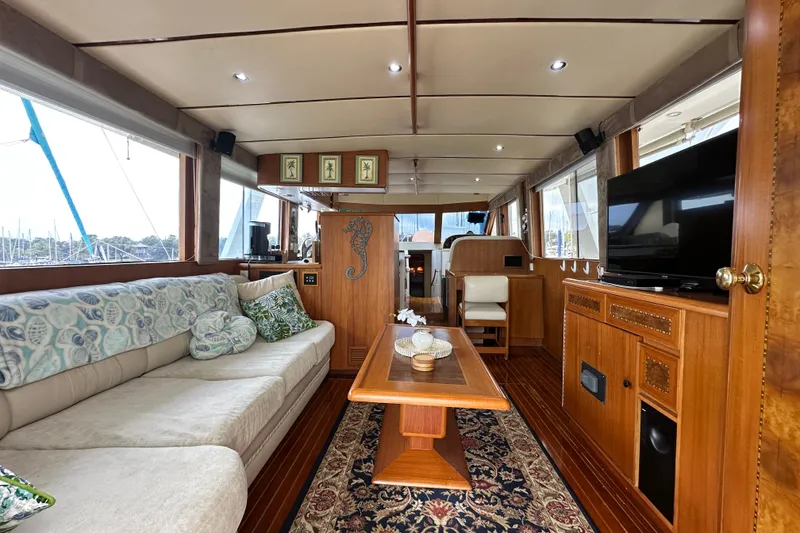 Slide: The Image of Luxurious interior of 2001 Prima 52 Seahorse yacht with elegant wood finishes and comfortable seating. - 24