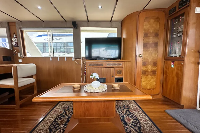 Slide: The Image of Luxurious interior of 2001 Prima 52 Seahorse yacht with wooden furnishings and elegant decor. - 29