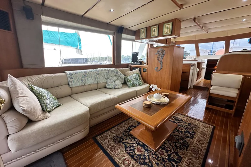 Slide: The Image of Luxurious interior of 2001 Prima 52 Seahorse yacht with elegant seating and wooden decor. - 32