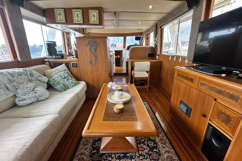 Slide: The Image of Luxurious interior of 2001 Prima 52 Seahorse yacht with elegant wood furnishings and cozy seating. - 34