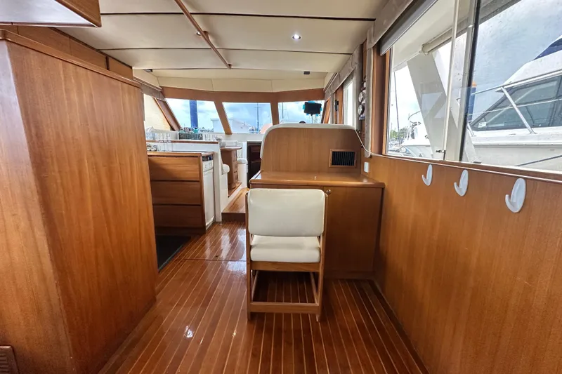 Slide: The Image of Interior of 2001 Prima 52 Seahorse yacht with wooden furnishings and seating. - 35