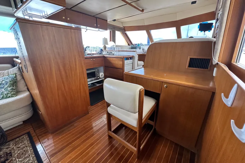 Slide: The Image of Interior of 2001 Prima 52 Seahorse yacht with wooden furnishings and seating area. - 36