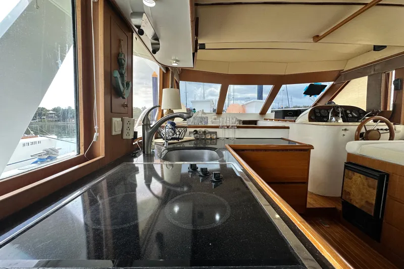 Slide: The Image of Interior view of 2001 Prima 52 Seahorse yacht with modern kitchen and helm. - 42