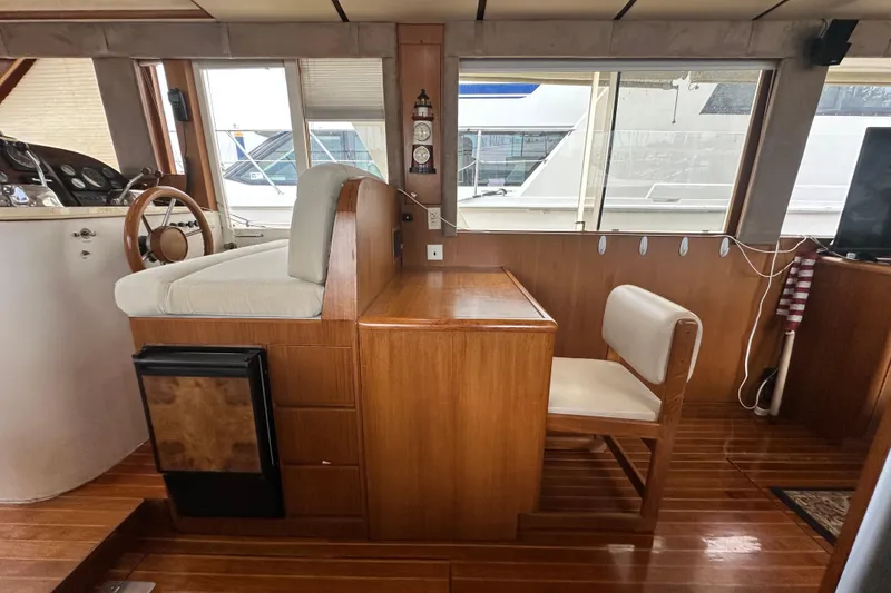 Slide: The Image of Interior of 2001 Prima 52 Seahorse yacht with wooden furnishings and helm station. - 44