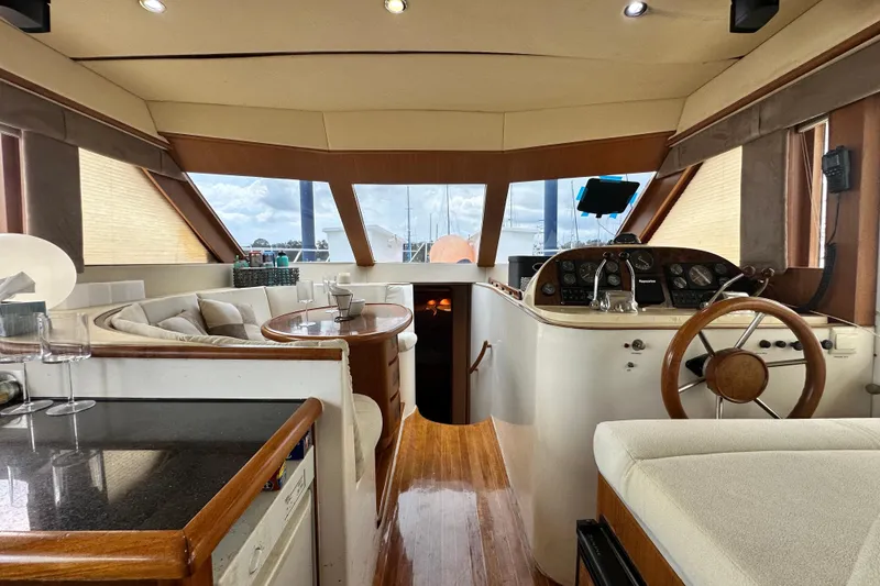 Slide: The Image of Luxurious interior of 2001 Prima 52 Seahorse yacht with helm and seating area. - 45