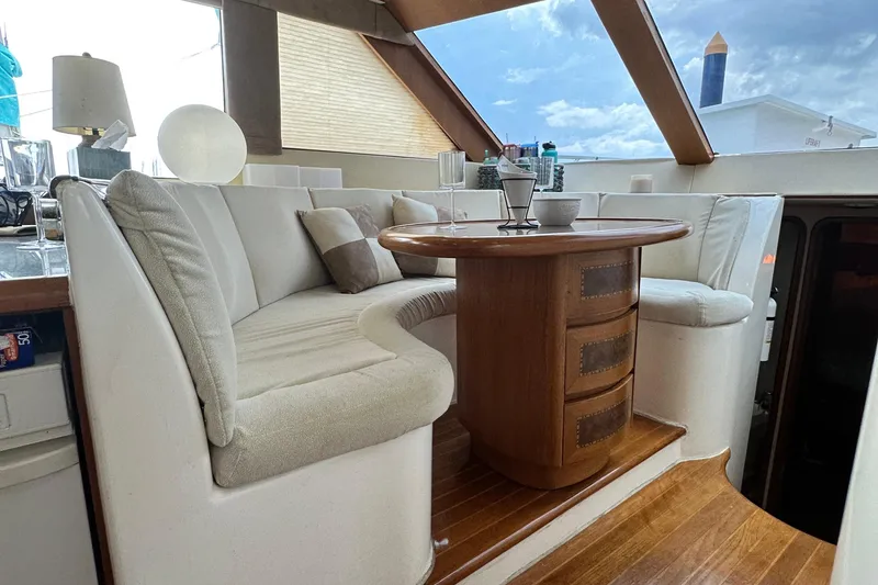 Slide: The Image of Luxurious interior of 2001 Prima 52 Seahorse yacht with elegant seating and wooden table. - 48