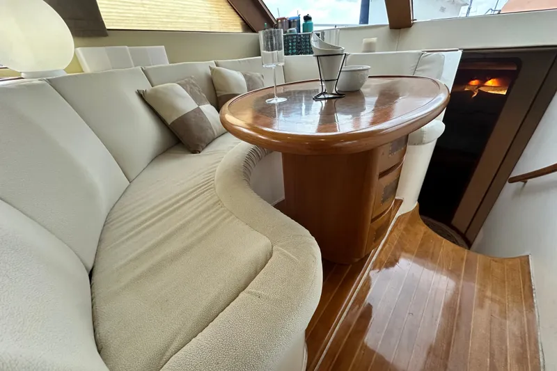 Slide: The Image of Luxurious interior of 2001 Prima 52 Seahorse yacht with elegant seating and wooden table. - 50