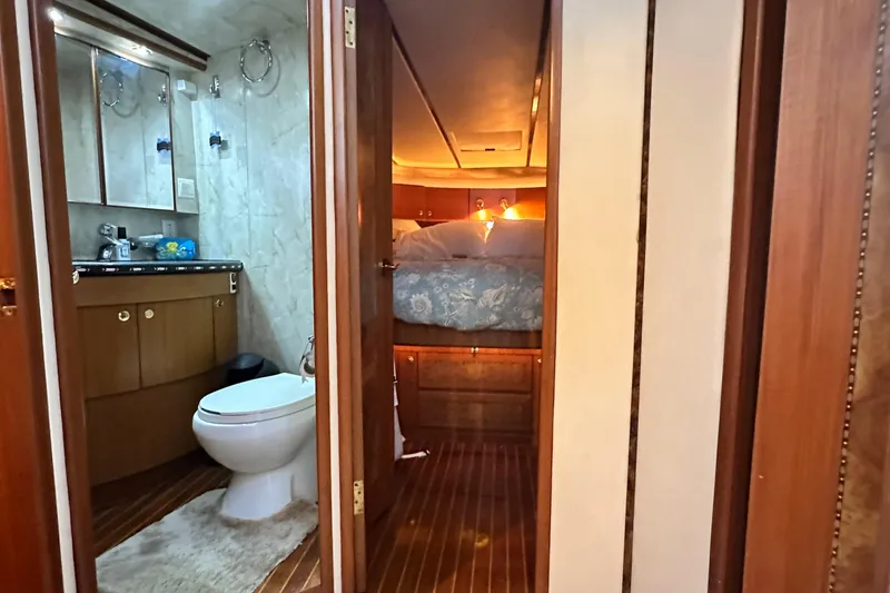 Slide: The Image of Luxurious interior of 2001 Prima 52 Seahorse yacht with bathroom and cozy bedroom. - 54