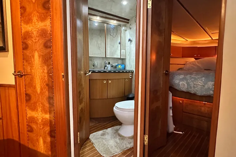 Slide: The Image of Luxurious 2001 Prima 52 Seahorse yacht interior with bathroom and cozy bedroom. - 55