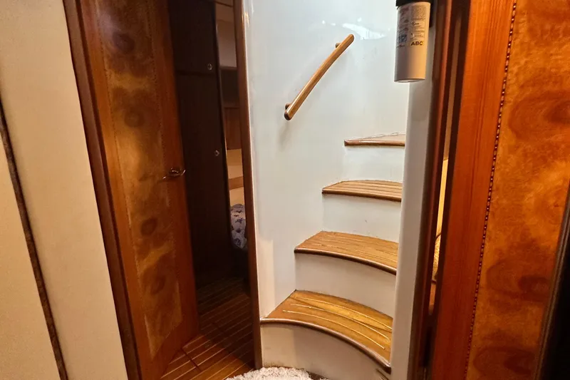 Slide: The Image of Interior of 2001 Prima 52 Seahorse yacht with wooden stairs and cabin door. - 57