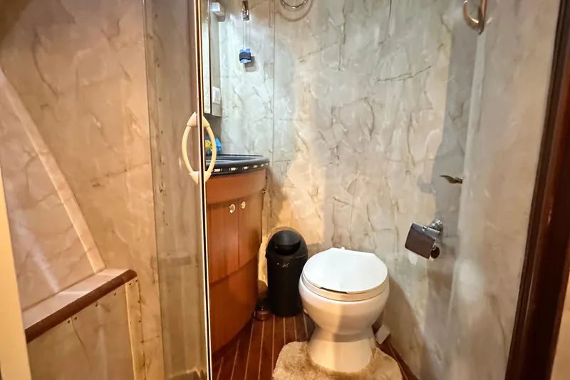 Slide: The Image of Bathroom interior of 2001 Prima 52 Seahorse yacht with marble walls and wooden accents. - 58