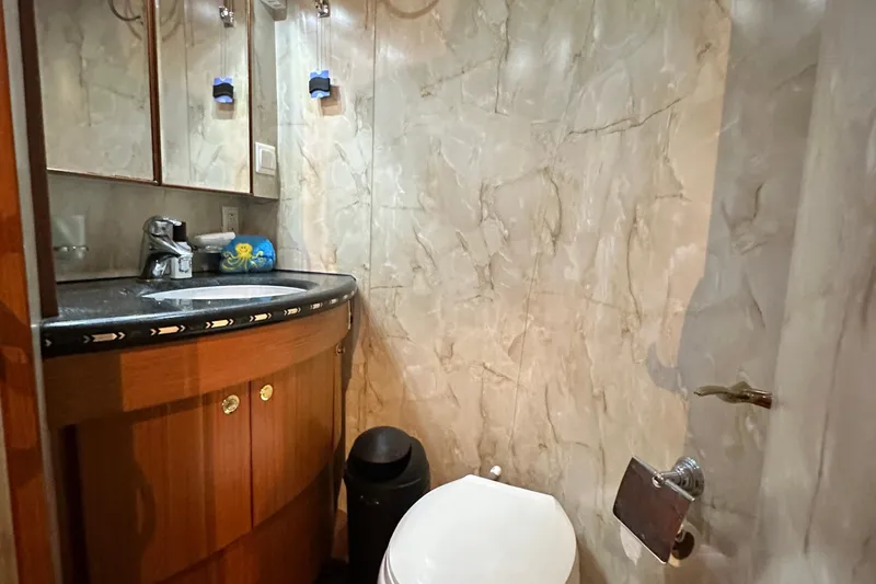 Slide: The Image of Luxurious bathroom in 2001 Prima 52 Seahorse yacht with marble walls and modern fixtures. - 59