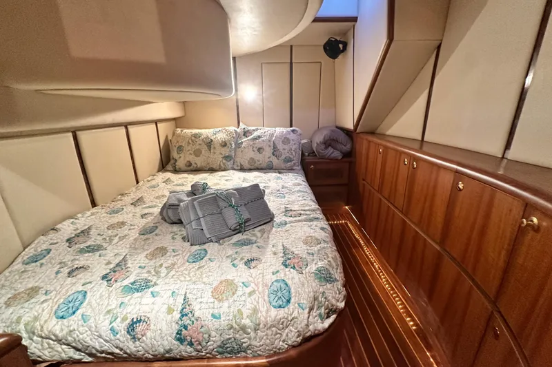 Slide: The Image of Luxurious cabin interior of 2001 Prima 52 Seahorse yacht with cozy bedding and wooden cabinetry. - 60