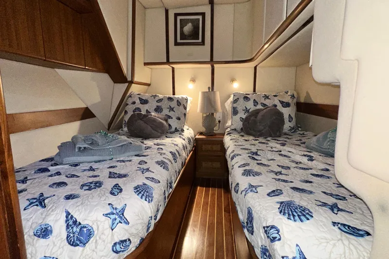 Slide: The Image of Cozy cabin interior of 2001 Prima 52 Seahorse yacht with twin beds and nautical decor. - 64