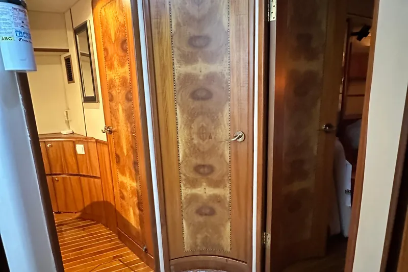 Slide: The Image of Interior of 2001 Prima 52 Seahorse yacht with elegant wooden doors and cabinetry. - 65