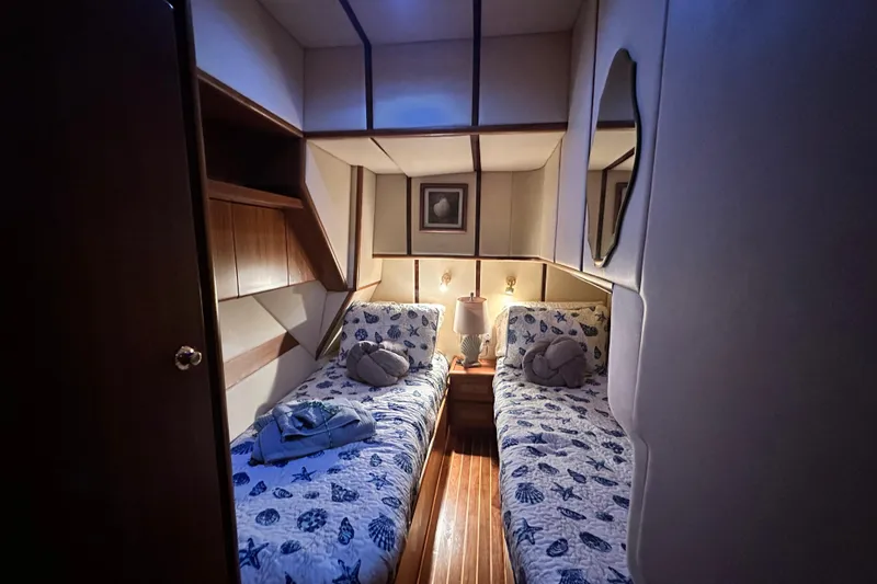 Slide: The Image of Cozy twin cabin in 2001 Prima 52 Seahorse yacht with nautical-themed bedding. - 66