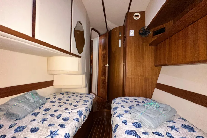 Slide: The Image of Cabin interior of 2001 Prima 52 Seahorse yacht with twin beds and nautical decor. - 67