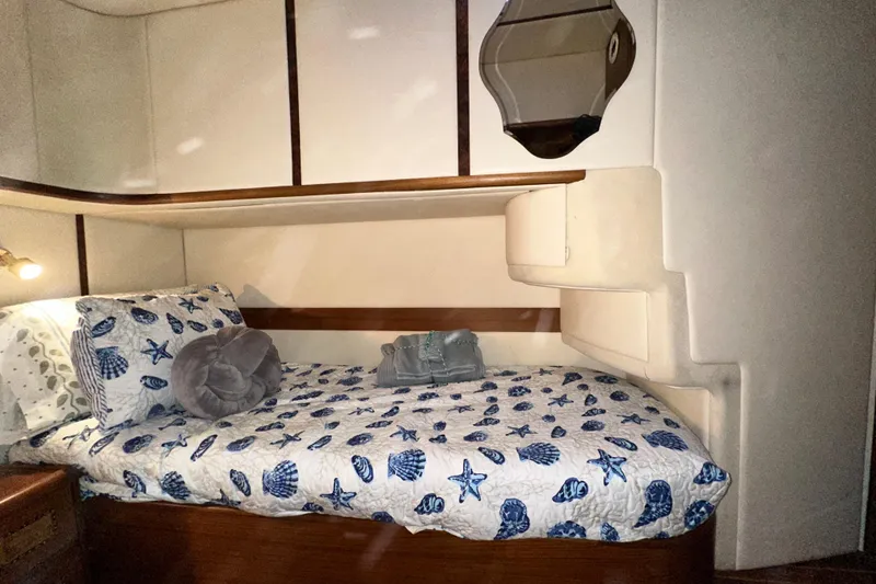 Slide: The Image of Cozy cabin interior of 2001 Prima 52 Seahorse yacht with nautical-themed bedding. - 68