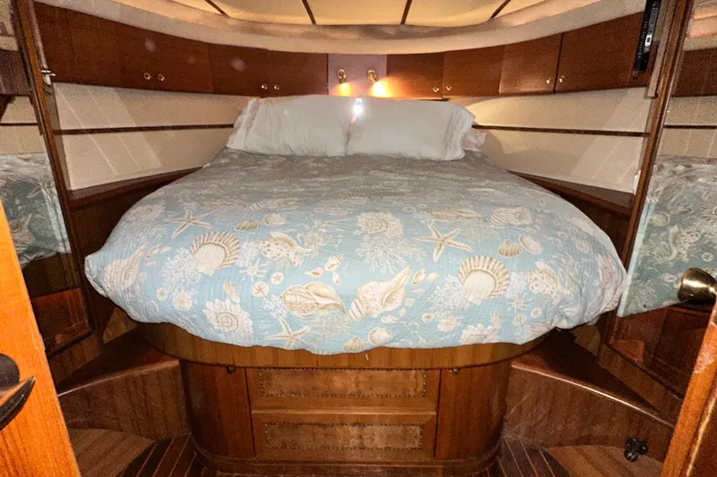 Slide: The Image of Luxurious cabin interior of 2001 Prima 52 Seahorse yacht with seashell-themed bedding. - 69