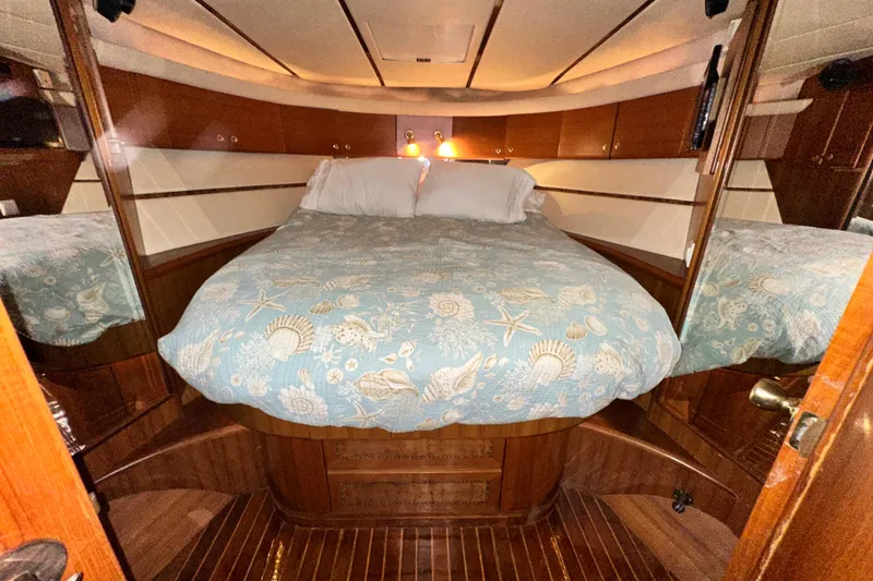 Slide: The Image of Luxurious cabin interior of 2001 Prima 52 Seahorse yacht with cozy bed and wooden finish. - 70