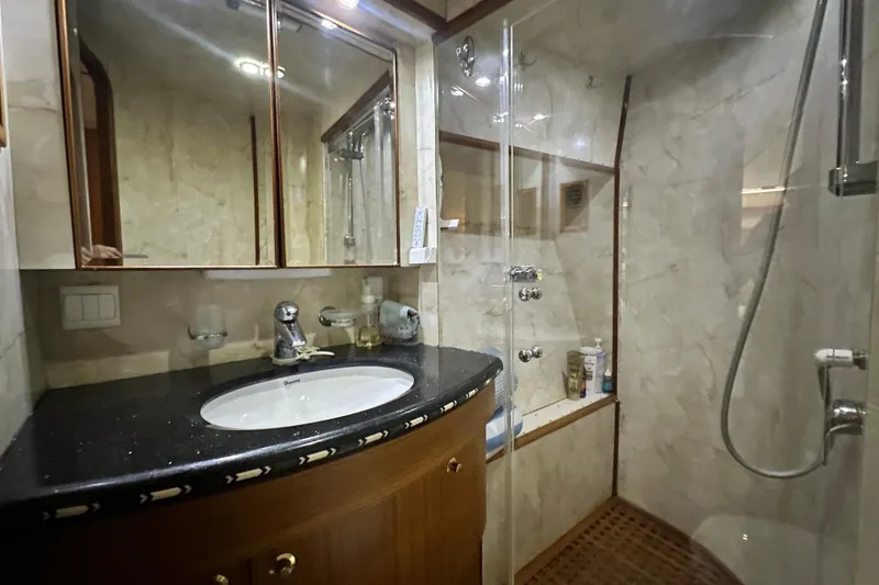 Slide: The Image of Luxurious bathroom in 2001 Prima 52 Seahorse yacht with marble walls and glass shower. - 76