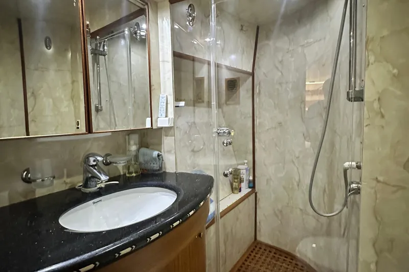 Slide: The Image of Luxurious bathroom in 2001 Prima 52 Seahorse yacht with marble walls and modern fixtures. - 77