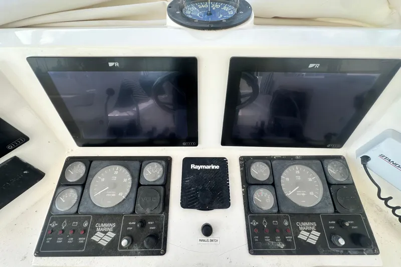 Slide: The Image of Control panel of a 2001 Prima 52 Seahorse boat with navigation screens and gauges. - 85