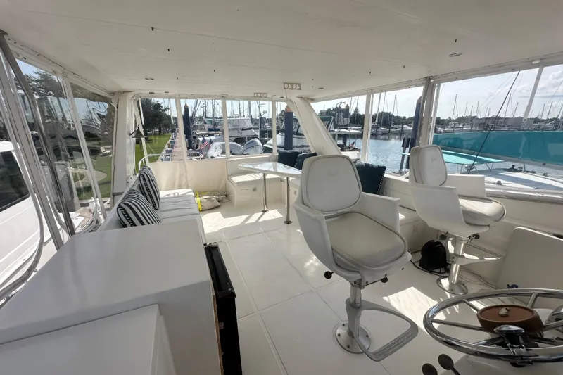 Slide: The Image of Spacious interior of 2001 Prima 52 Seahorse yacht with seating and marina view. - 88