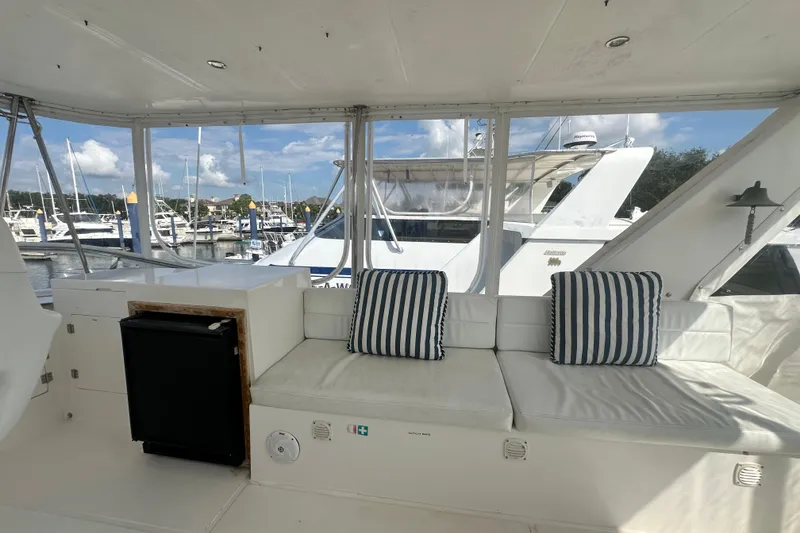 Slide: The Image of Interior of 2001 Prima 52 Seahorse yacht with striped cushions and marina view. - 89