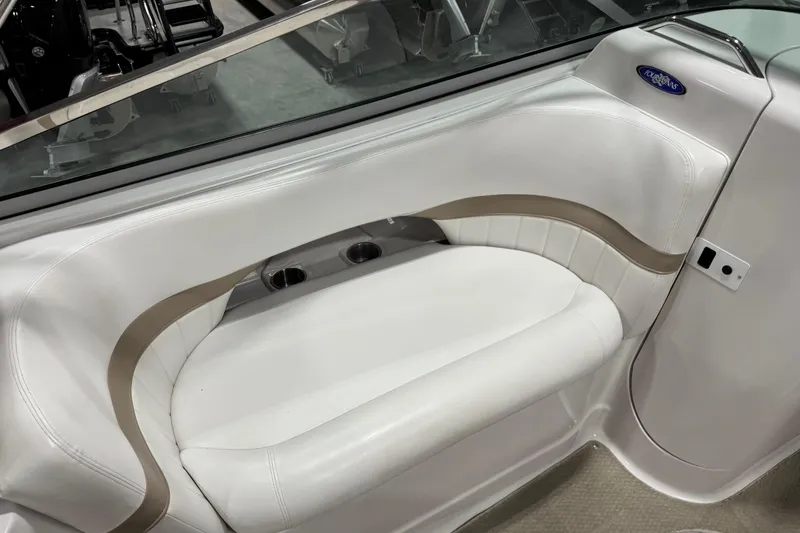 Slide: The Image of 2005 Four Winns 290 Horizon boat interior with white seating and cup holders. - 10