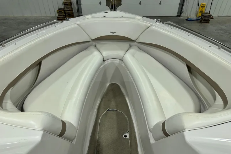 Slide: The Image of 2005 Four Winns 290 Horizon boat interior with white seating and beige accents. - 12