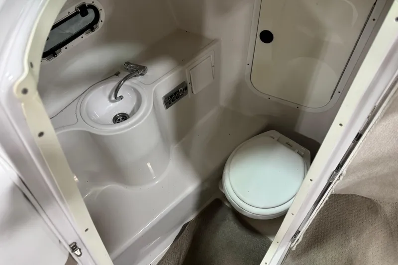 Slide: The Image of 2005 Four Winns 290 Horizon boat bathroom with sink and toilet. - 13